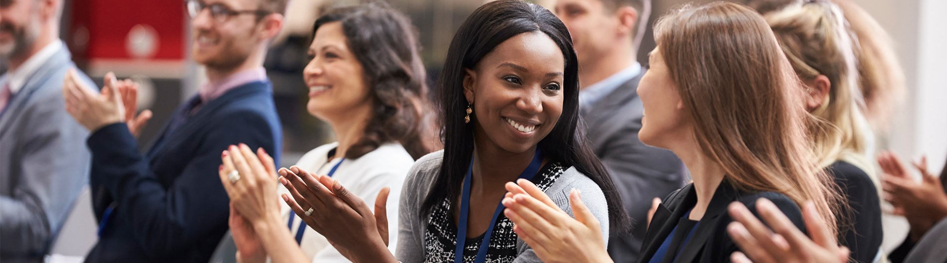 People clapping at a workshop event