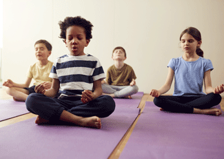 Kids doing yoga