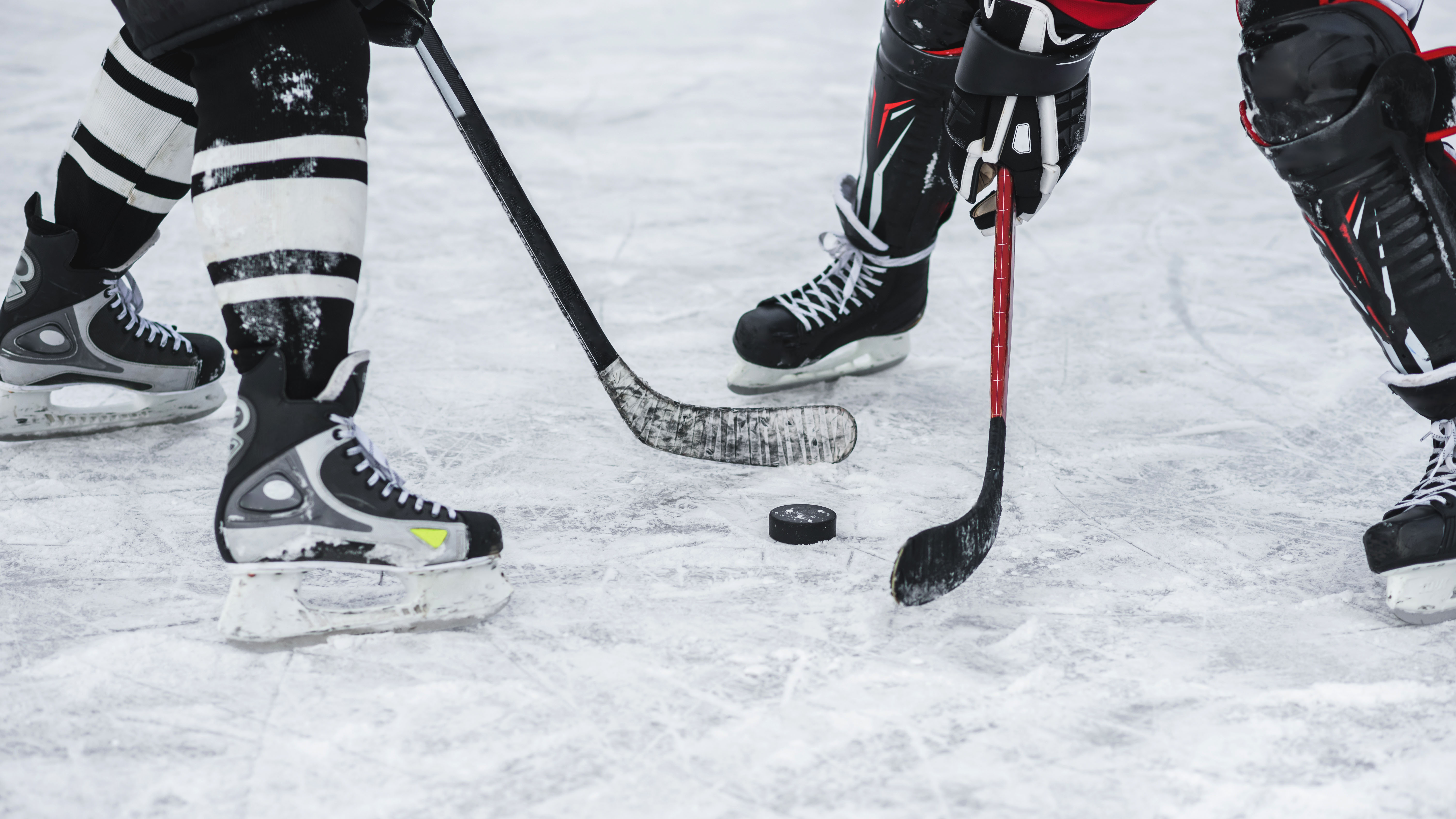 hockey players at centre ice