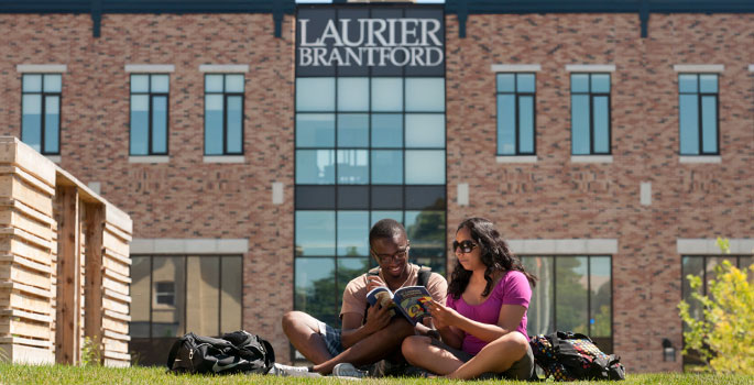 Students sitting on the grass