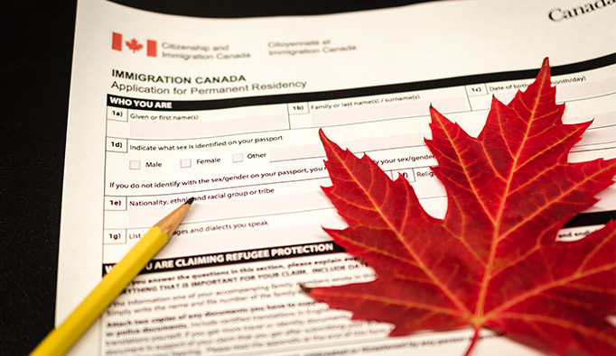 Canadian immigration papers and pencil