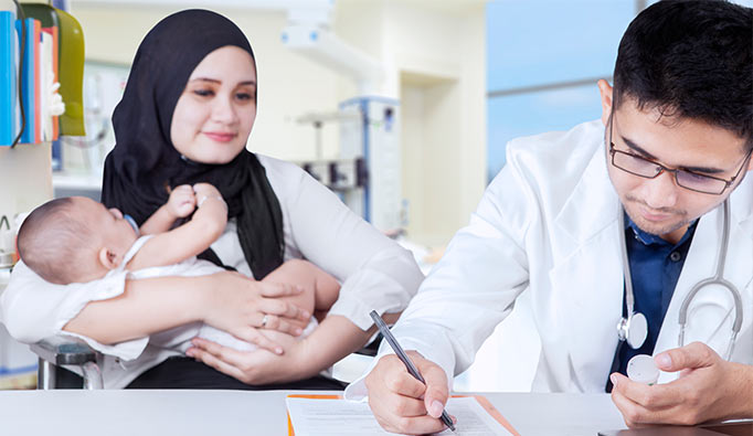 Woman with baby visiting the doctor