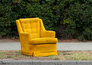old chair sitting by curb