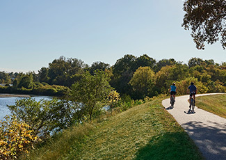 people on trail by grand river
