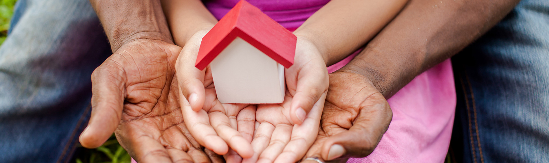 Hands holding a house