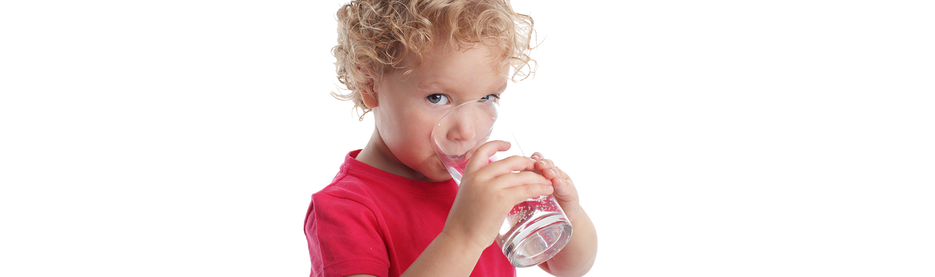 young boy drinking tap water