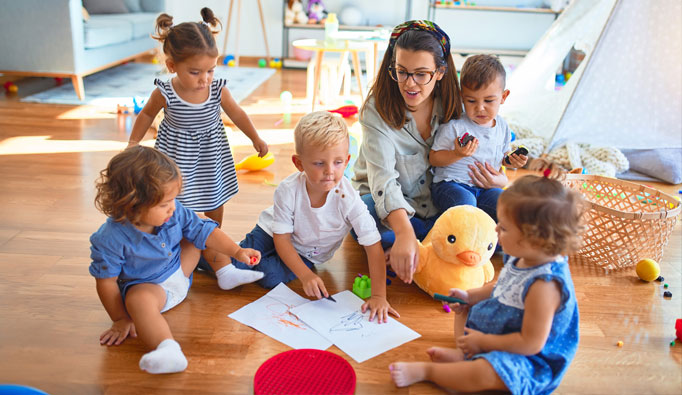 caretaker with toddlers