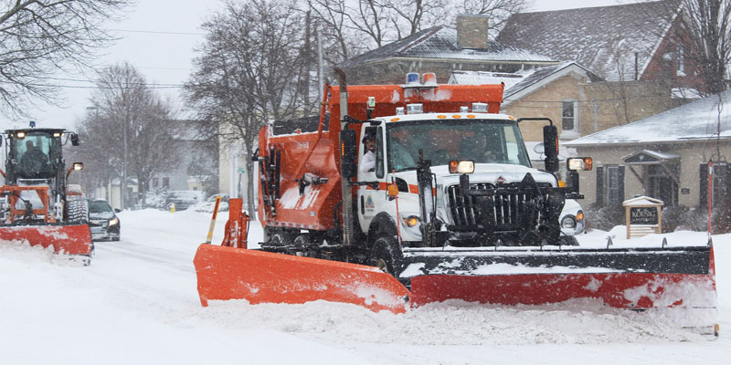 Snow removal on a snow covered street