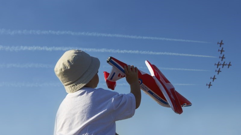 Child watching the Community Charity Airshow at the Brantford Airport