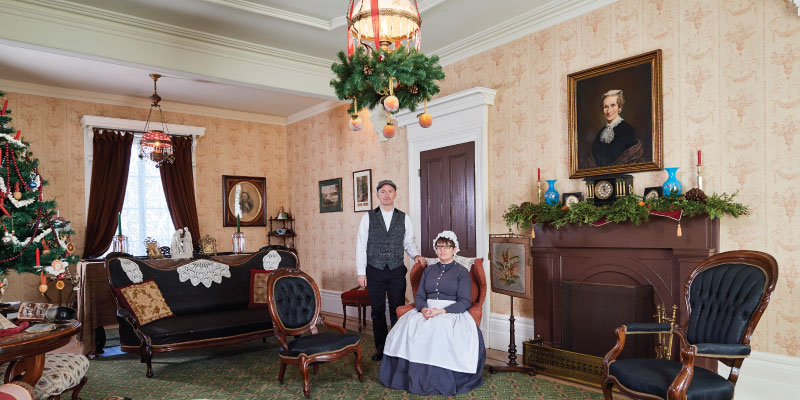 Bell Homestead living room decorated for the holidays