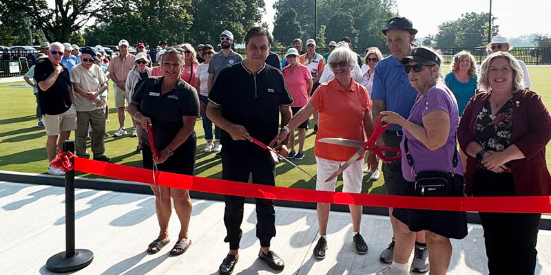 Group cutting ribbon at Brantford's new lawn bowling facility