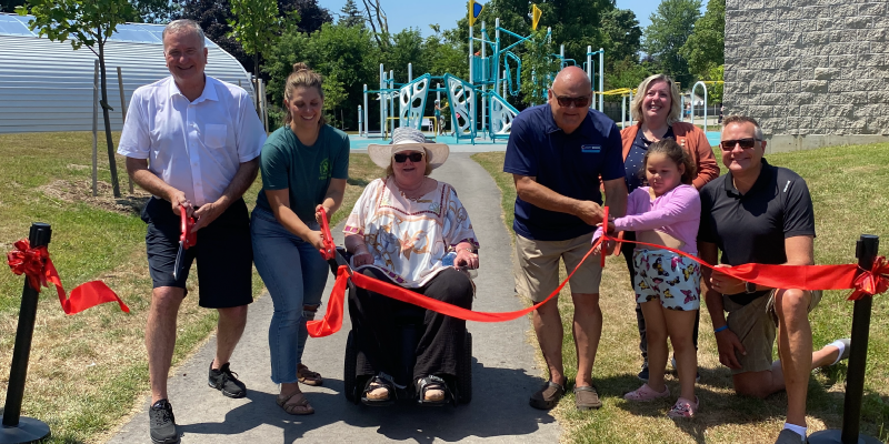 Group cutting ribbon at Woodman Park