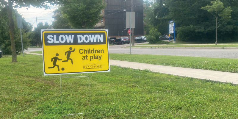 Slow Down Sign on lawn