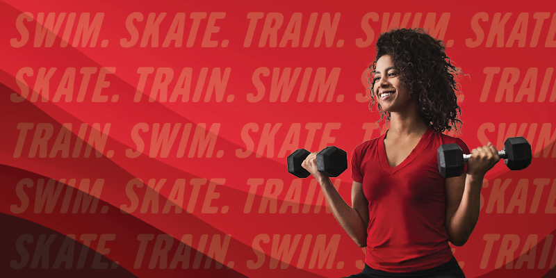 Person lifting hand weights. Red Swim, Skate Train in the background.