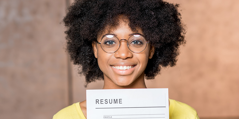 Person holding up a resume