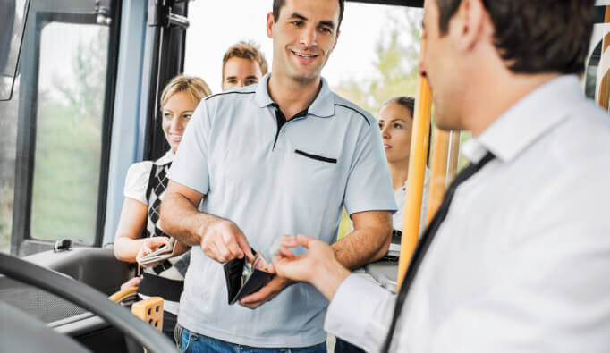 Man paying bus driver