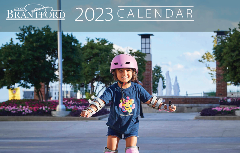 Cover of 2023 print calendar featuring a child rollerskating at Harmony Square