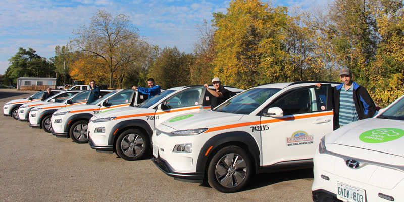 City of Brantford staff standing with new electric vehicle fleet