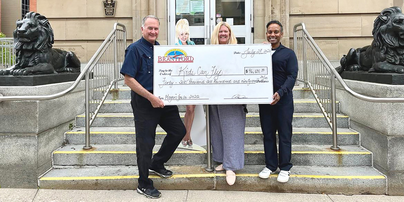 Check presentation in front of City Hall