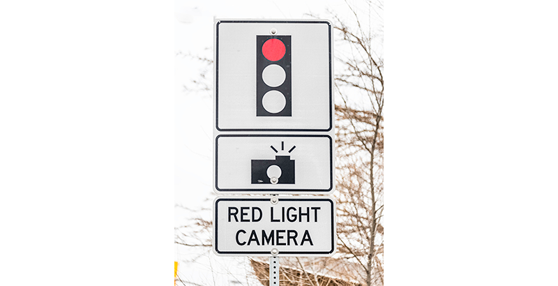 Red light camera sign