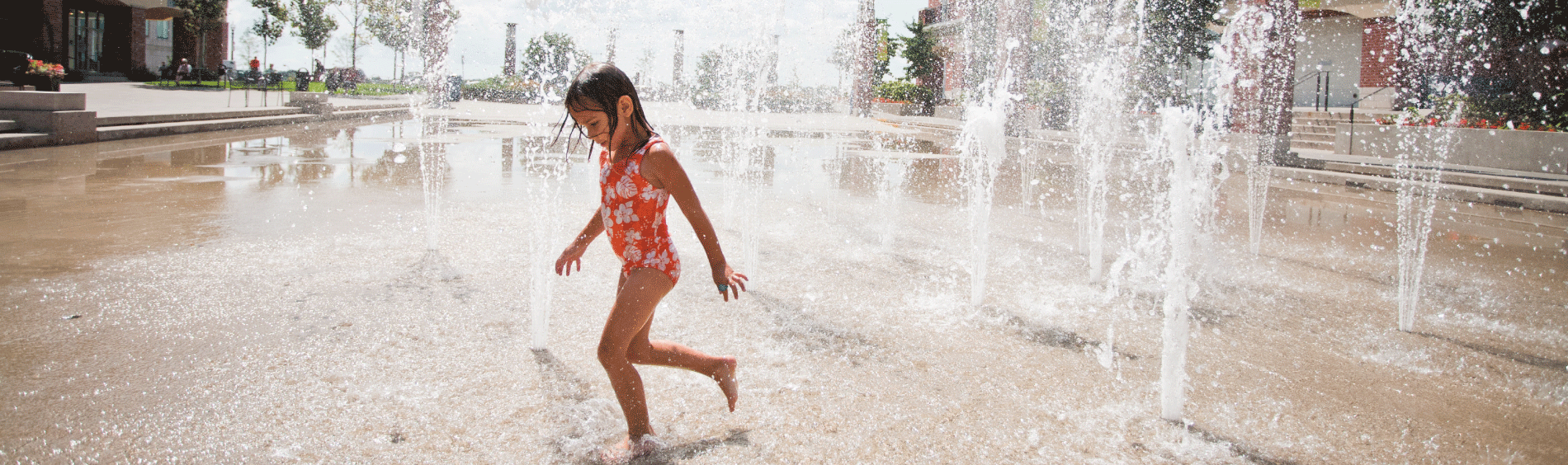 Child playing in splash pad