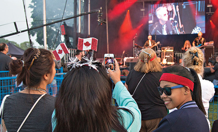 A crowd enjoying the Canada Day celebration