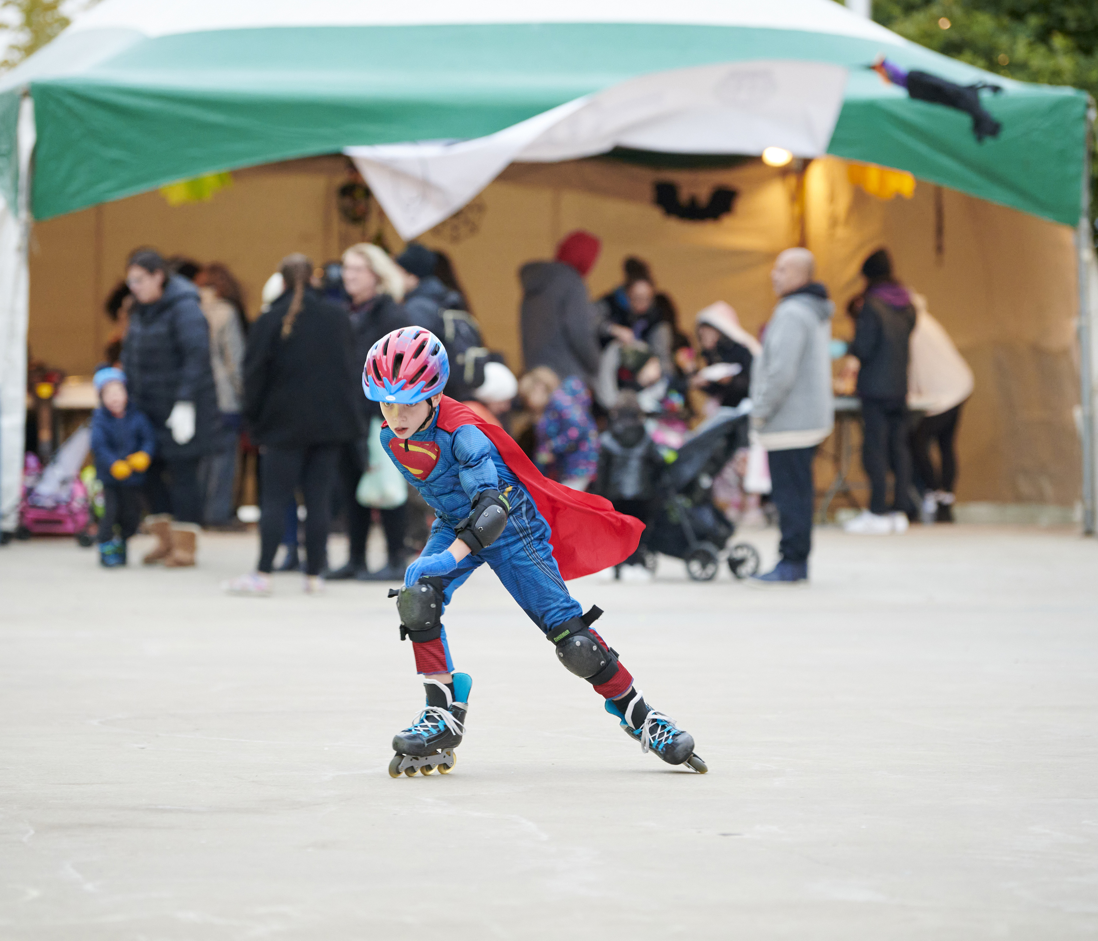 Boy in costumer rollerskating