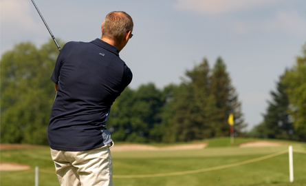 Man golfing on the golf green