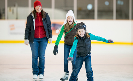 Family skating at an arena