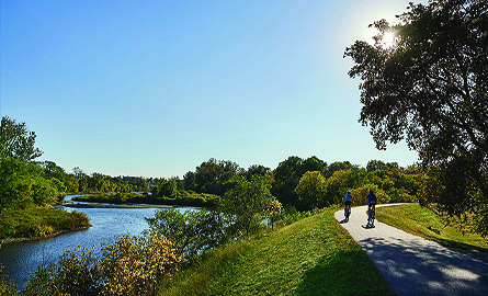 Photo of a trail and a river alongside it