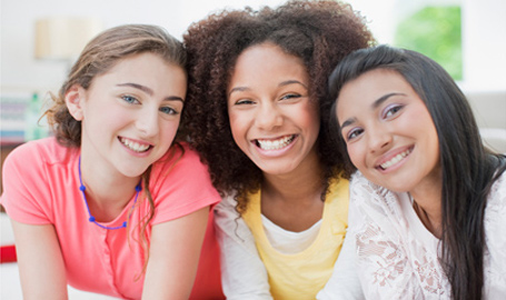 Three teens smiling