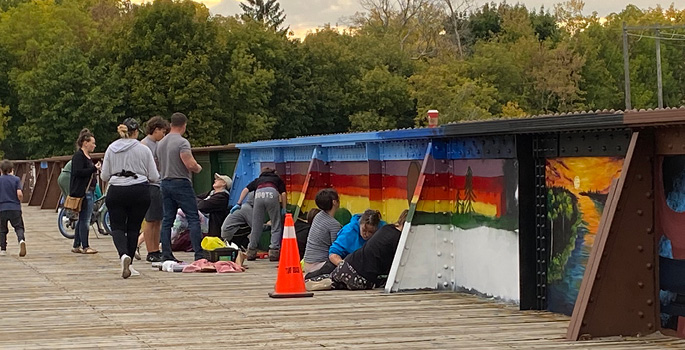 Artists painting the TH&B crossidge