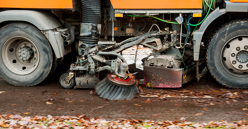 Street sweeper cleaning street