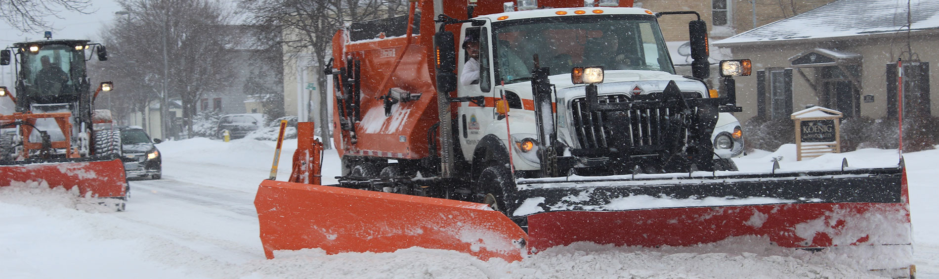 Street plows clearing snow