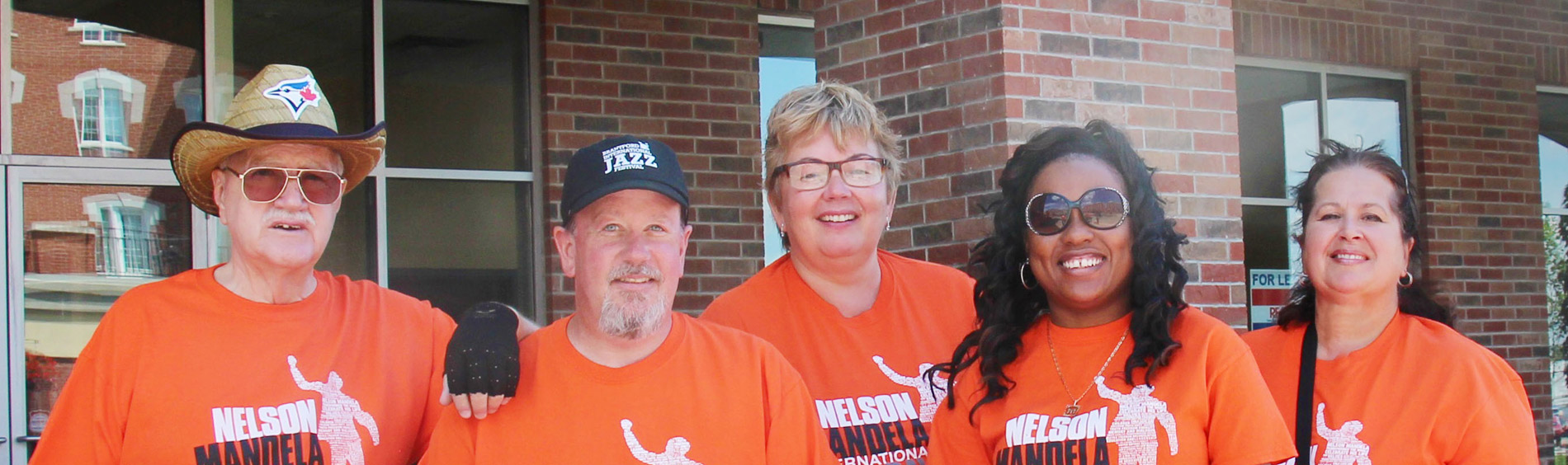 volunteers in orange t-shirts